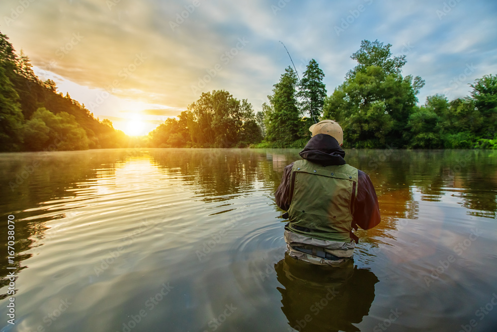 Sport fisherman hunting fish. Outdoor fishing in river