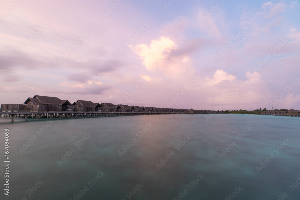 View of a tropical resort at sunset.