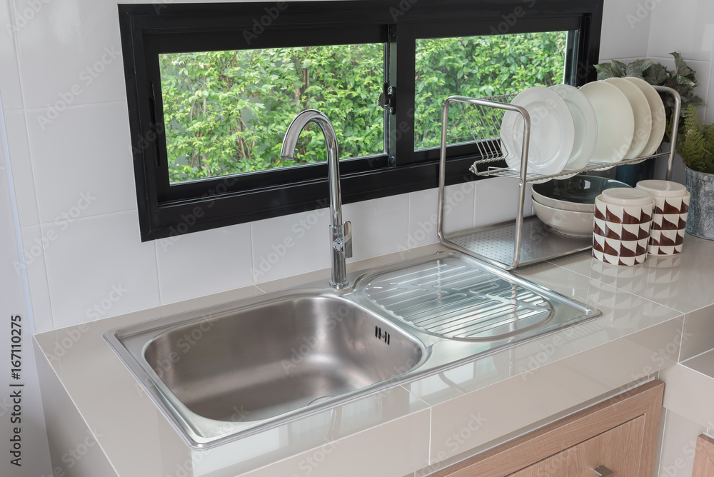 modern kitchen room with sink on counter