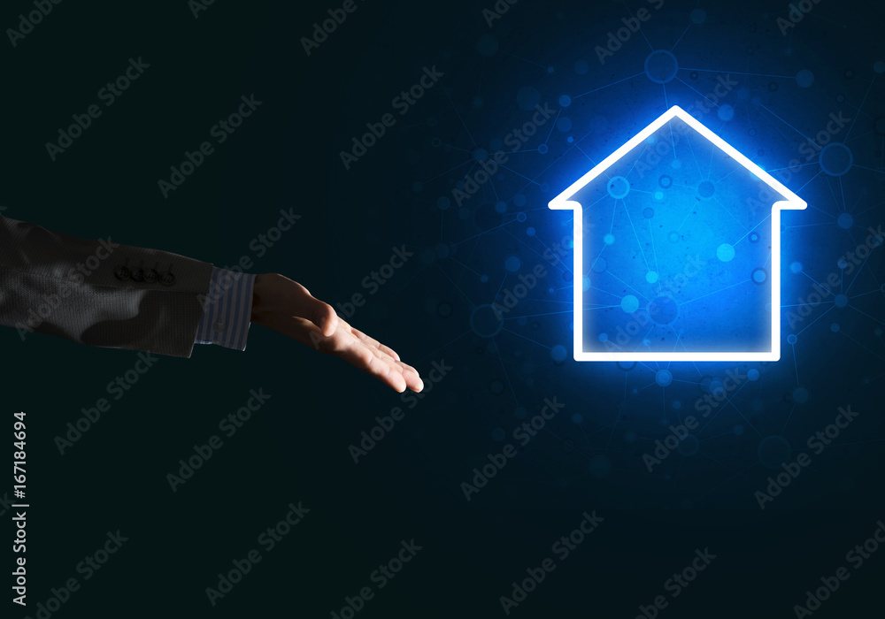 Conceptual image with hand pointing at house or main page icon on dark background