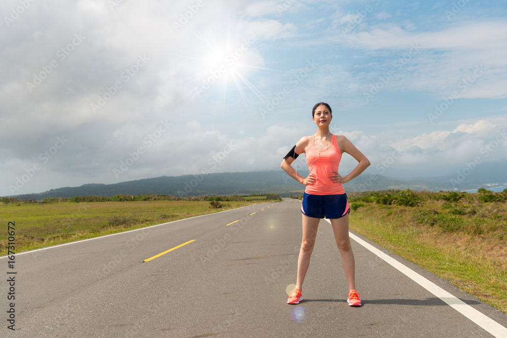 confident asian woman standing on the road