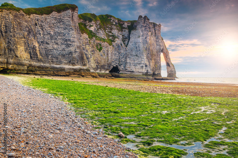 Stunning mossy beach and magical sunset near Etretat, Normandy, France