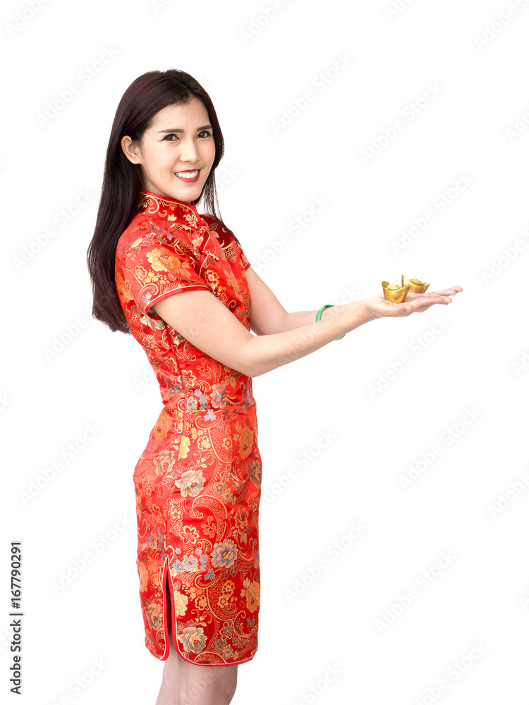 Chinese new year woman concept, isolated asian woman wearing red dress holding gold on hand