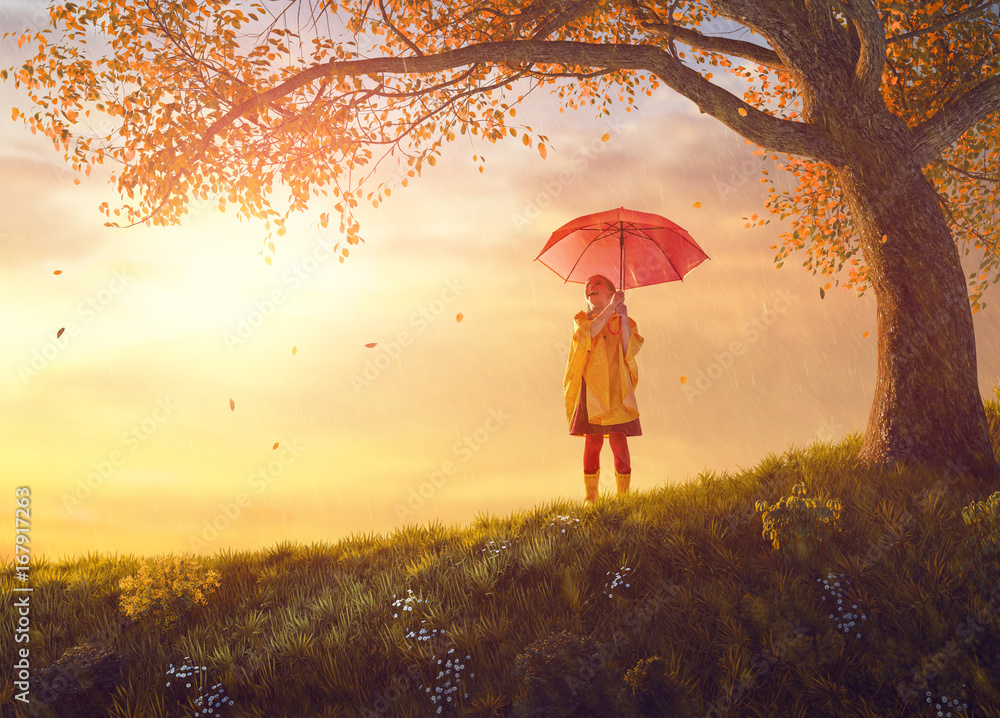 child with red umbrella