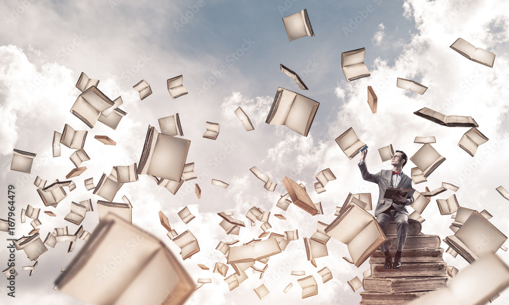 Young businessman or student studying the science and books fly 