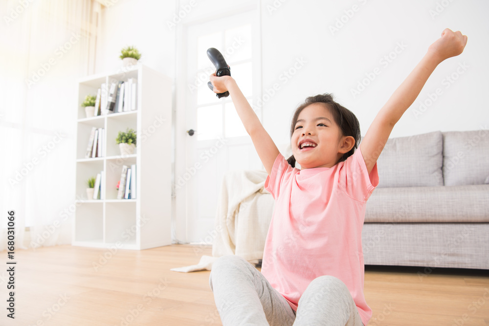 little daughter children holding game joystick