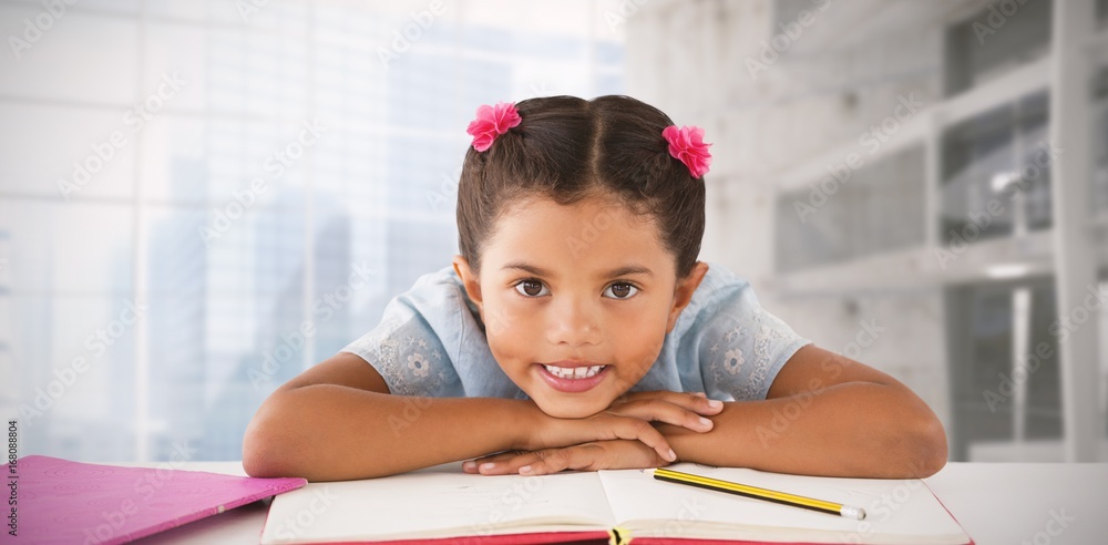 Composite image of girl clenching teeth while leaning on book