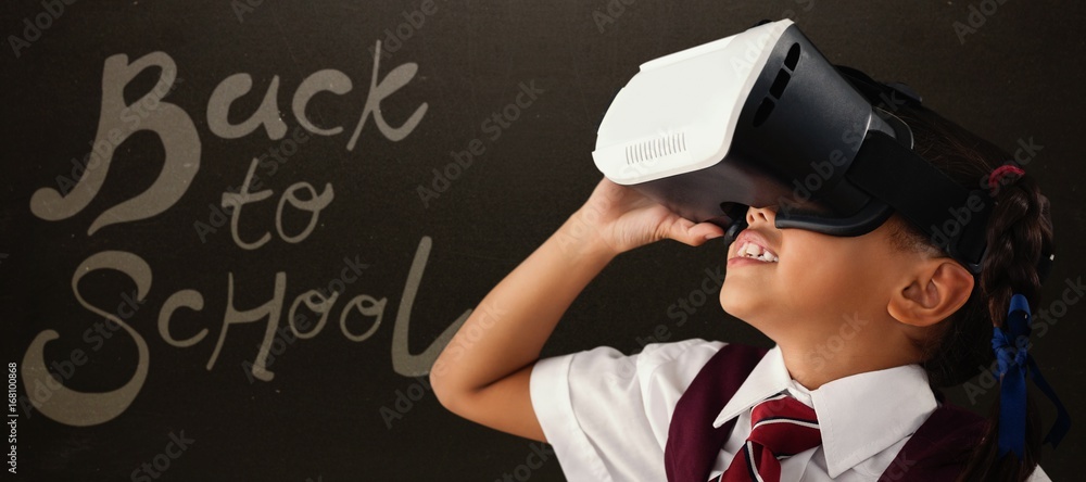 Composite image of close-up of schoolgirl using virtual reality 