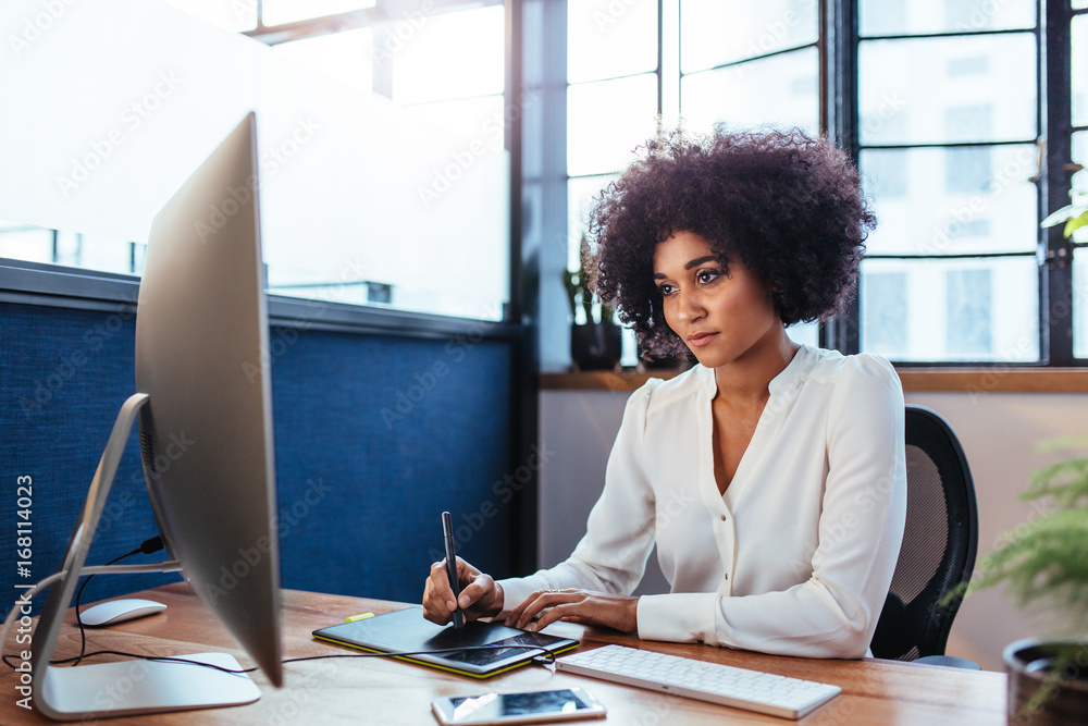 Female designer working in office