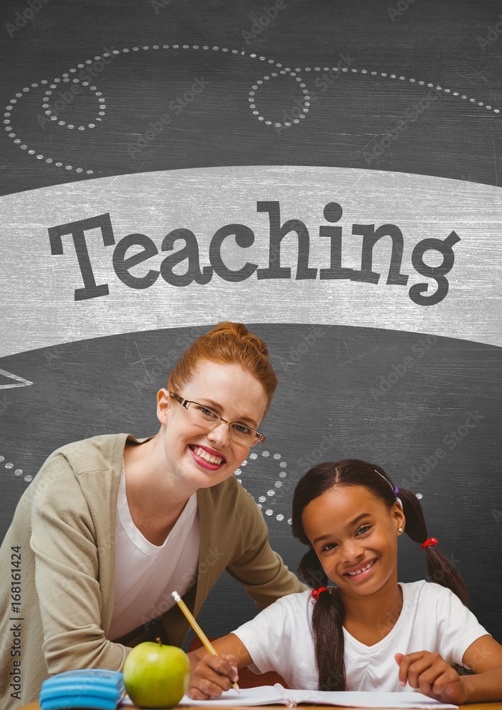 Happy student girl and teacher at table against grey blackboard 