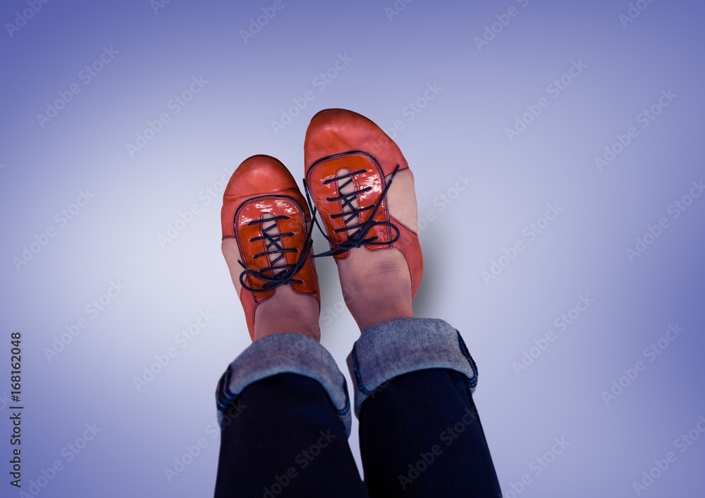 Red shoes on feet with purple background