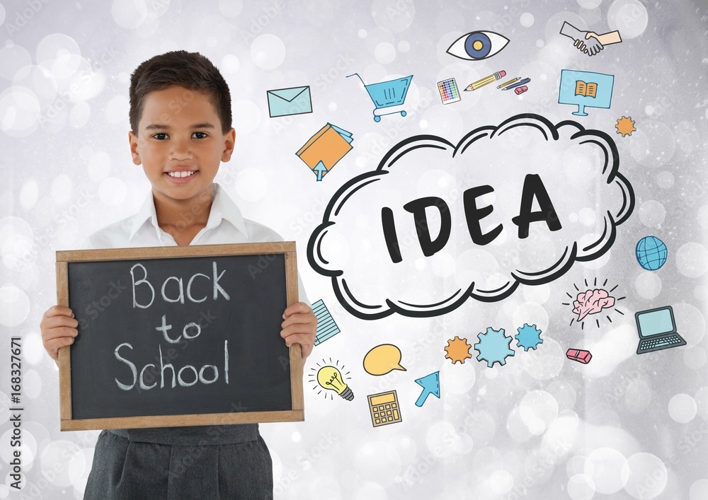 Boy holding back to school blackboard with idea graphics