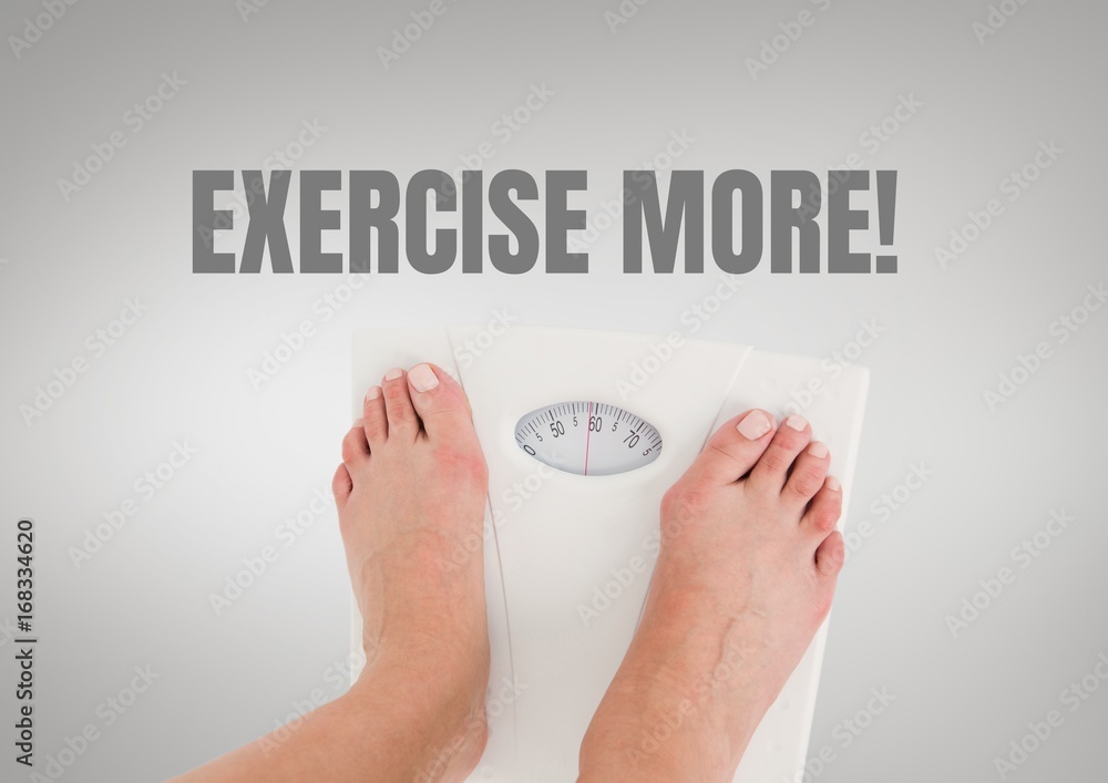 Exercise more text and feet on weighing scales with grey backgro