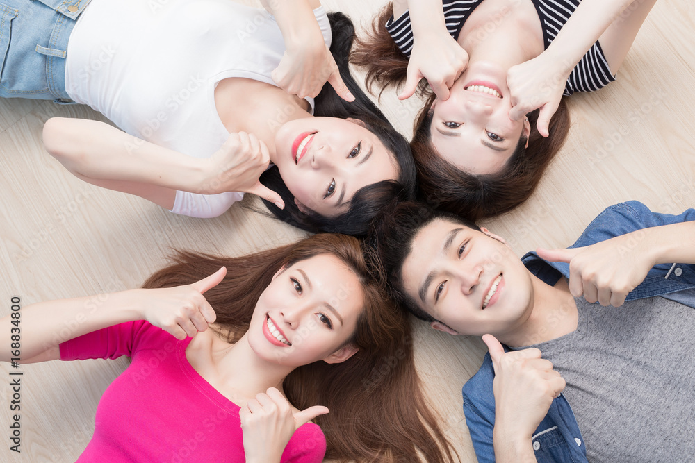 young people lying on floor