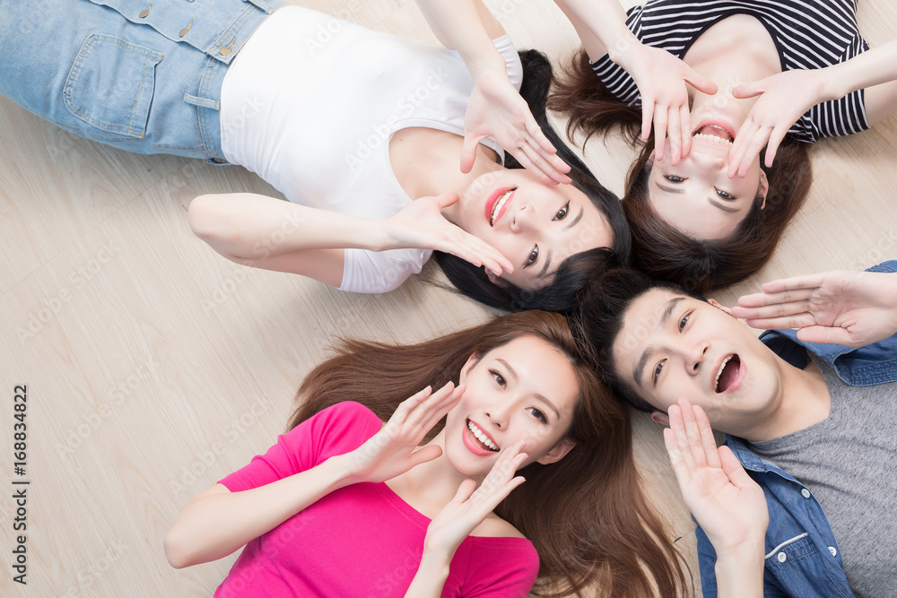 young people lying on floor