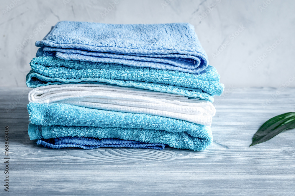 Towels pile in housekeeping set on laudry background mockup