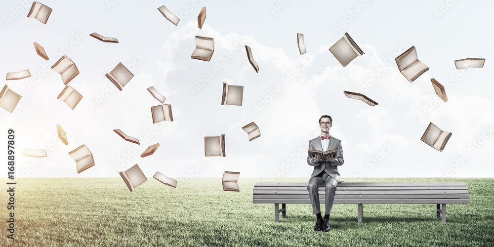 Young businessman or student studying the science and books fly 