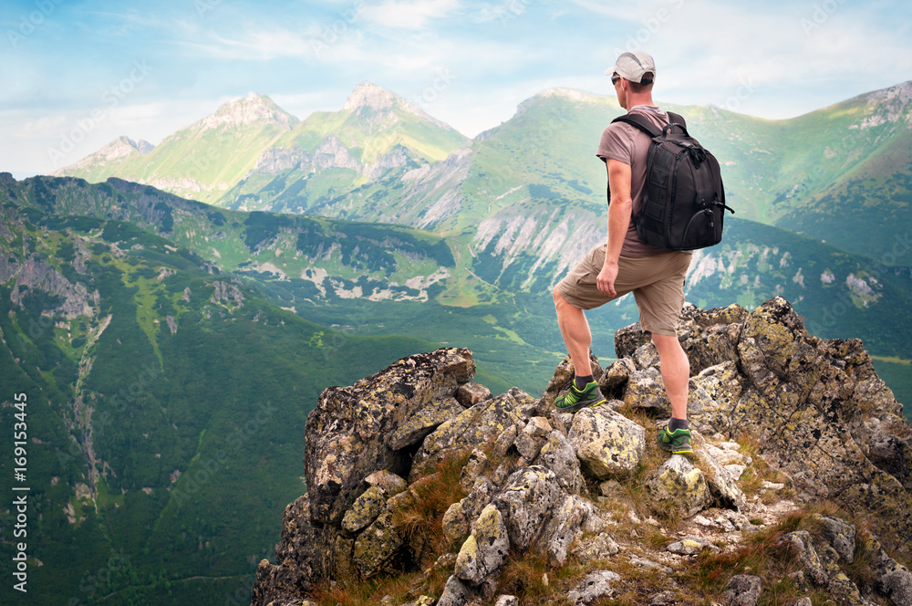 Hiker standing on top of the mountain