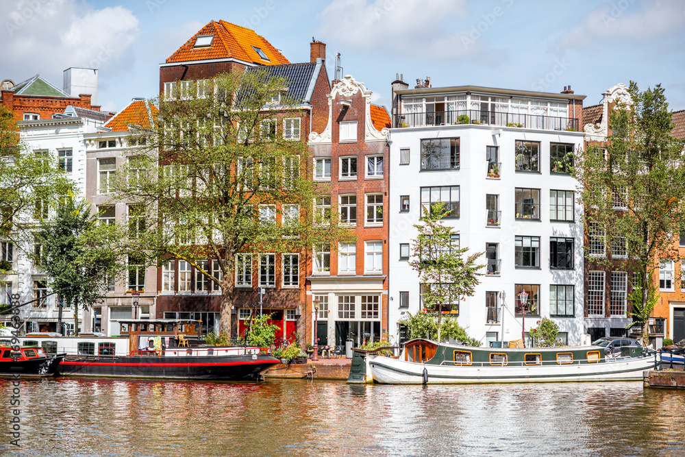 View on the beautiful old buildings and water channel in Amsterdam city