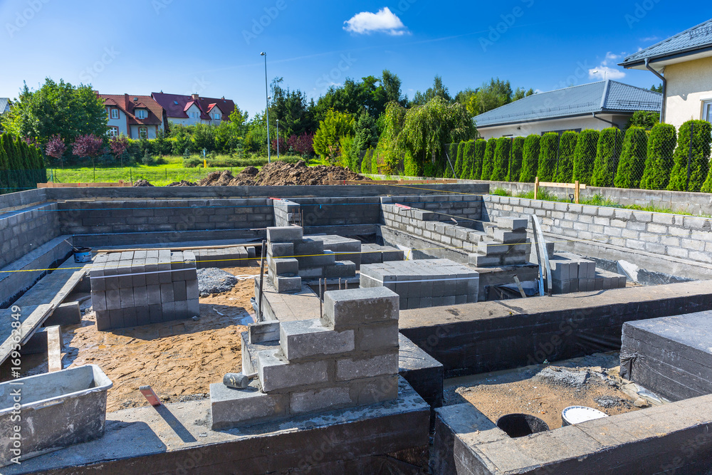 Brick up concrete blocks for foundation of a house