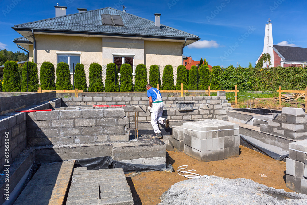 Brick up concrete blocks for foundation of a house