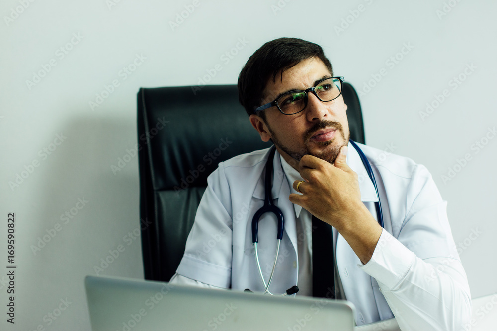 Doctor is working with laptop in his medical office,Community Health and Development Hospital In Rem