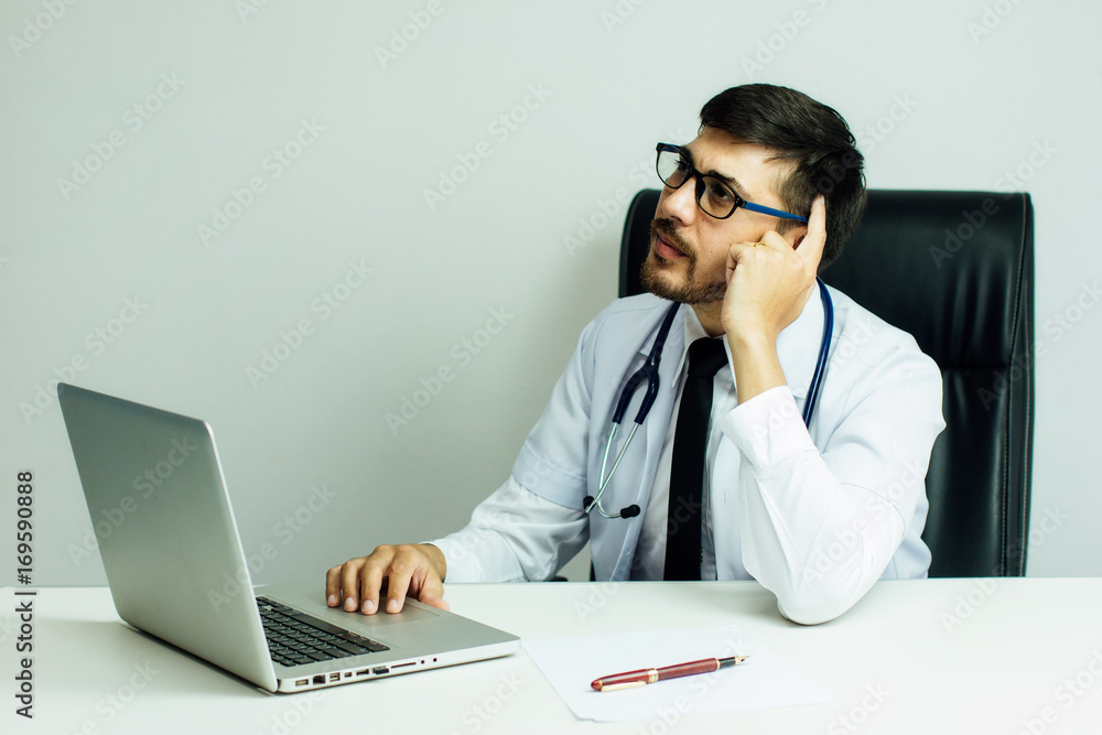 Doctor is working with laptop in his medical office,Community Health and Development Hospital In Rem