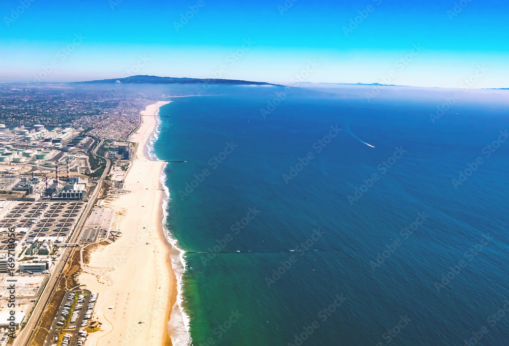 Aerial view of an oil refinery on the beach of El Segundo, Los Angeles, CA