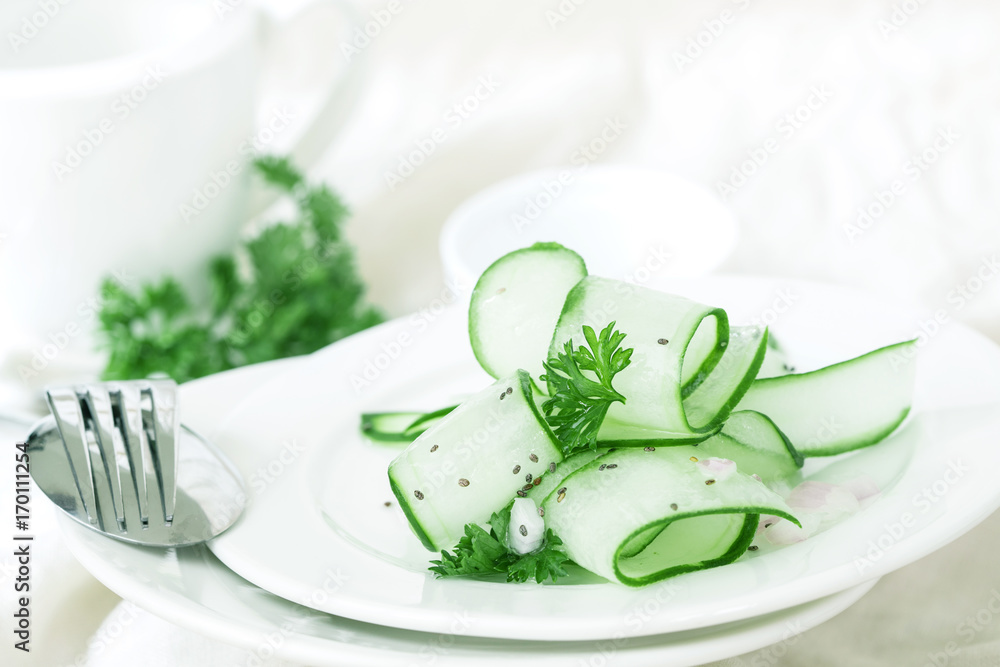 Close up cucumber salad and with the chia seeds and green parsley leaf , heathy salad for anti aging