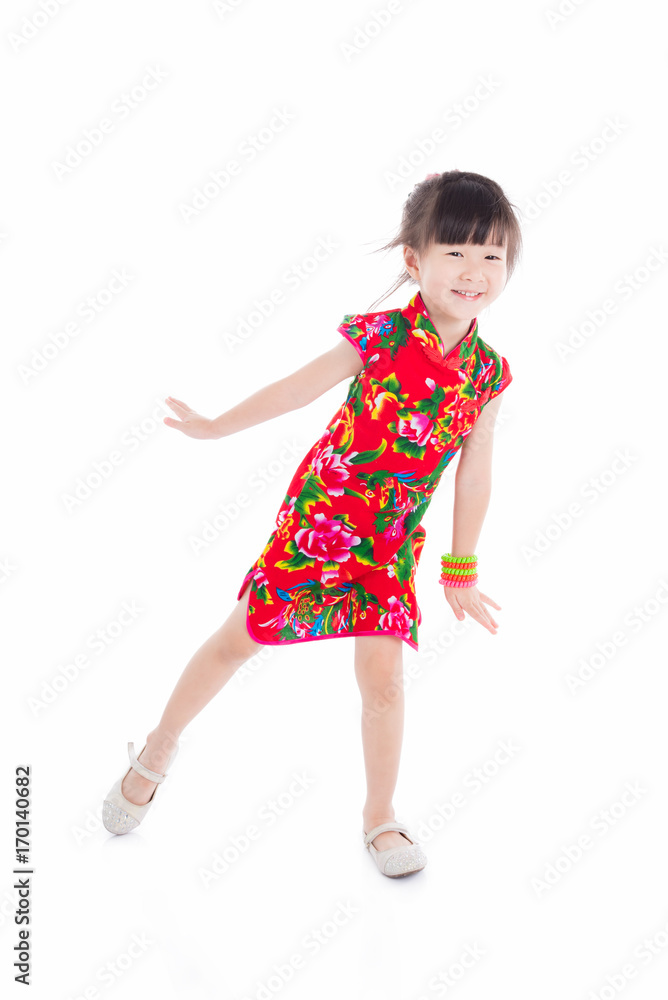 Little asian girl wearing red chinese traditional dress standing over white background