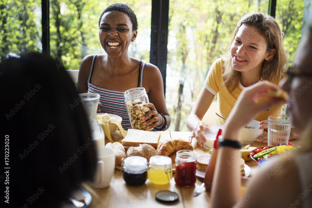 Group of diverse women having breakfast together