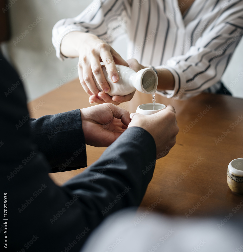 People pouring sake japanese alcohol drinking