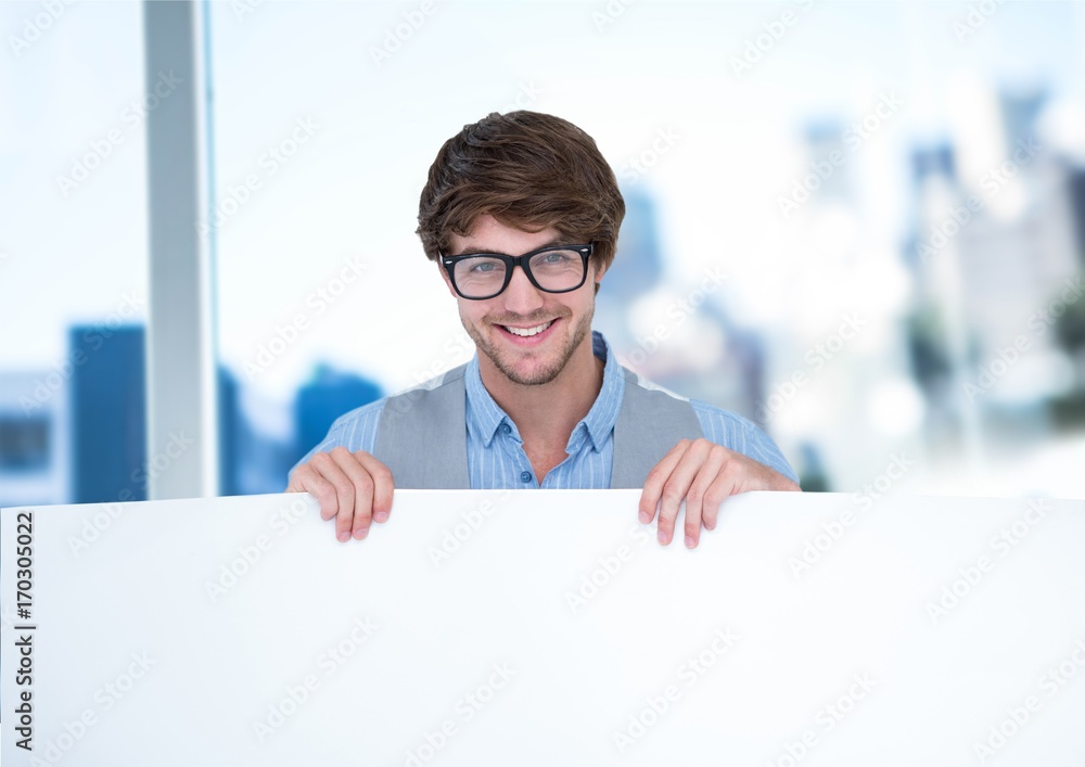 Business man holding blank card in office