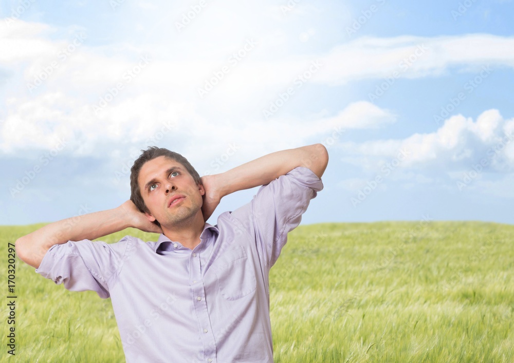 Businessman in nature field