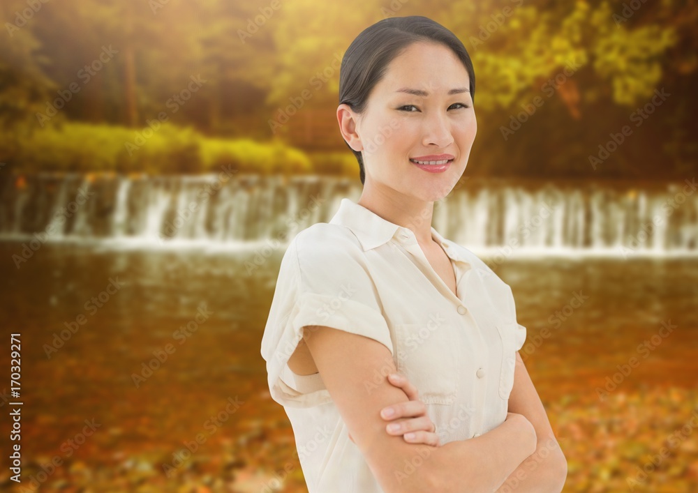 Businesswoman in nature with waterfall