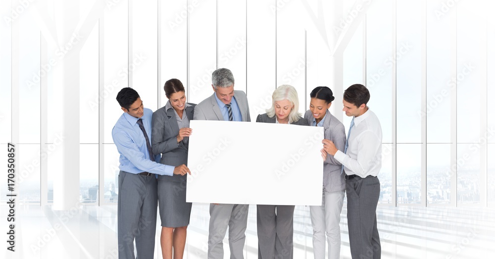 Business people holding blank card in office