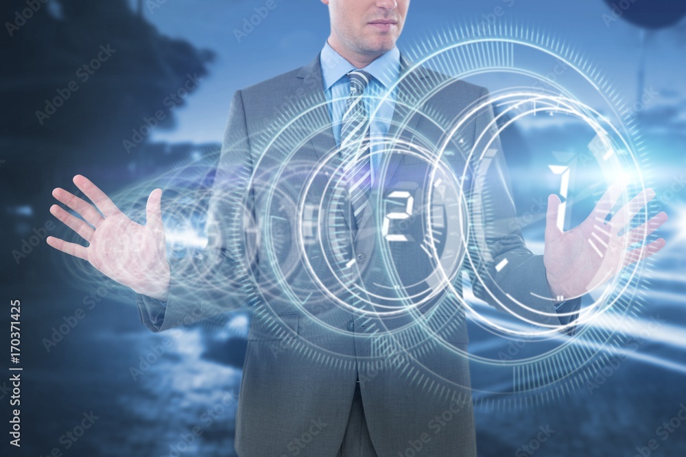 Composite image of businessman using futuristic digital screen