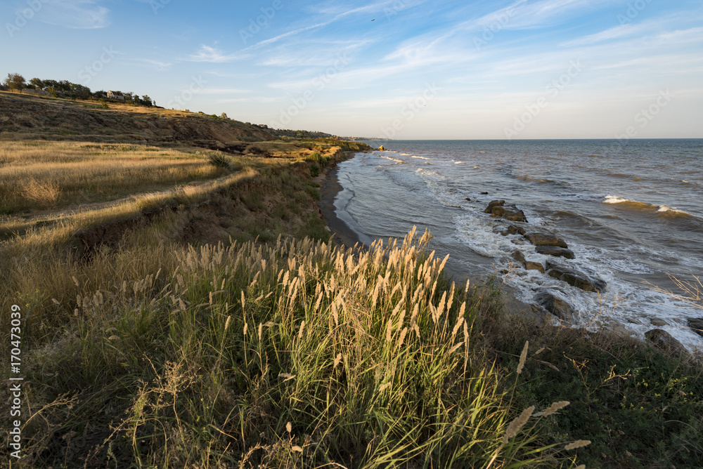 Coastline and sea in the evening sunlight