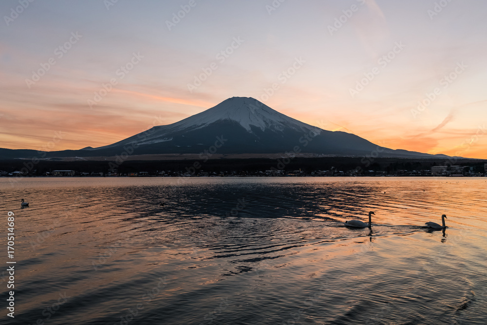 View of Mount Fuji and Lake Yamanakako in winter evening. Lake Yamanakako is the largest of the Fuji