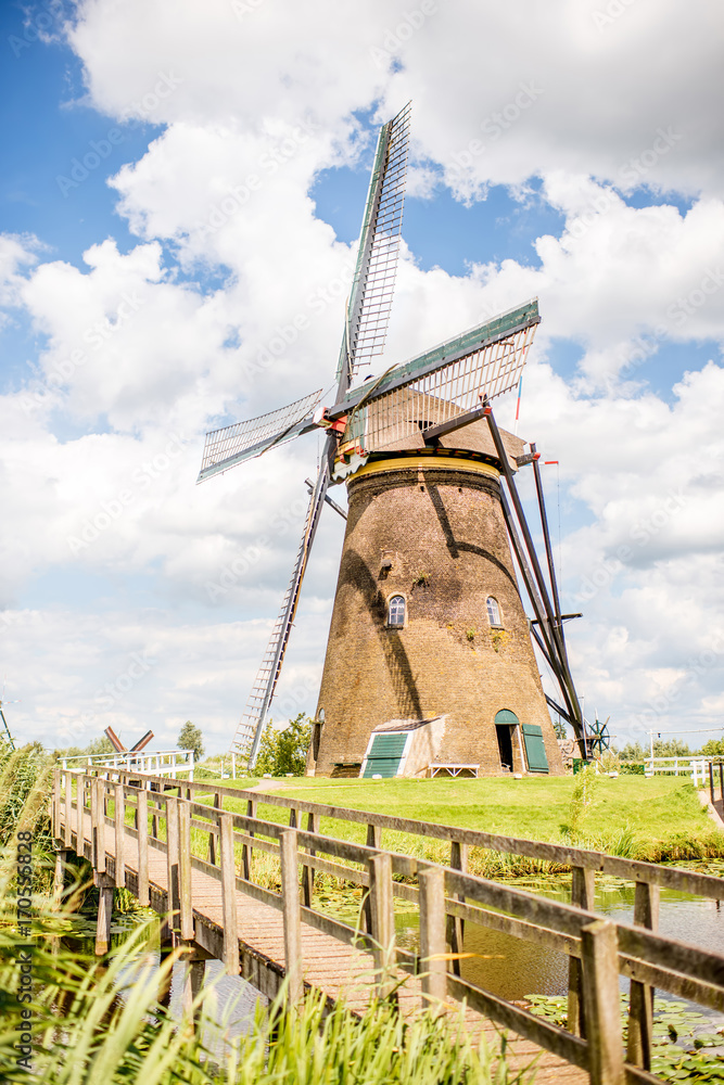 Landscape view on the old windmill in Kinderdijk village in Netherlands