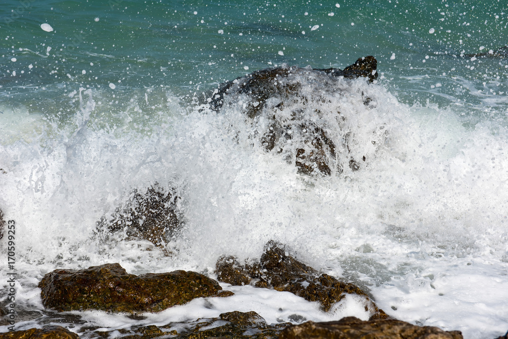 amazing nature background.The color of the water and beautifully bright.Azure beach with rocky mount