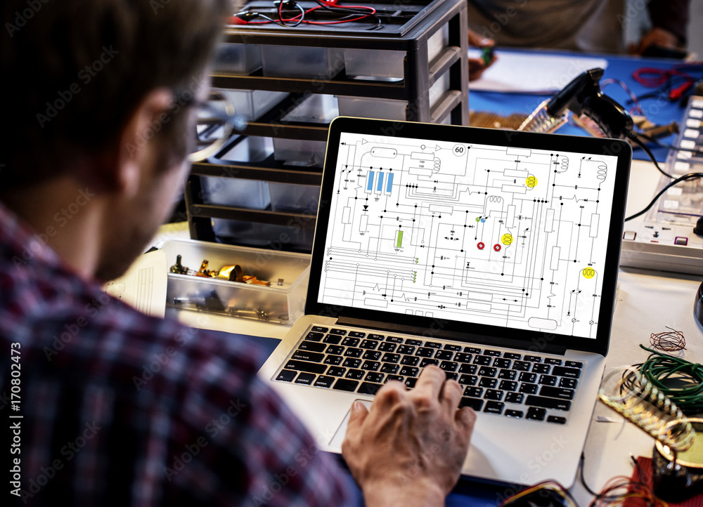 Computer laptop showing electronic circuit pattern