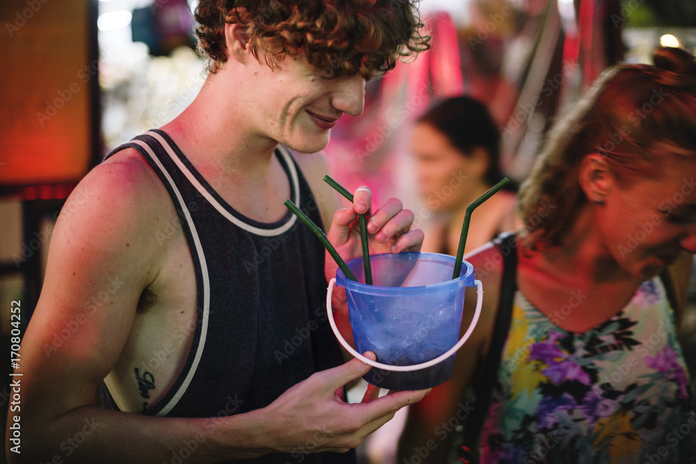 Tourist enjoy bucket drink in Khao San Road Bangkok Thailand walking street