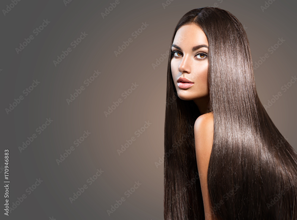 Beautiful long hair. Beauty woman with straight black hair on dark background