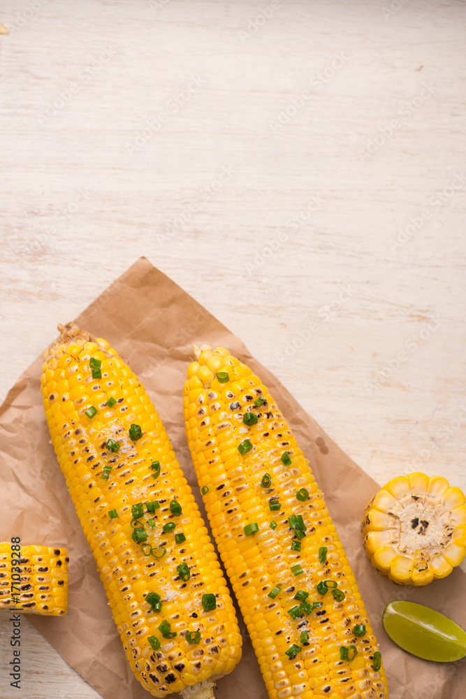 Tasty sweet grilled corn with onion sauce