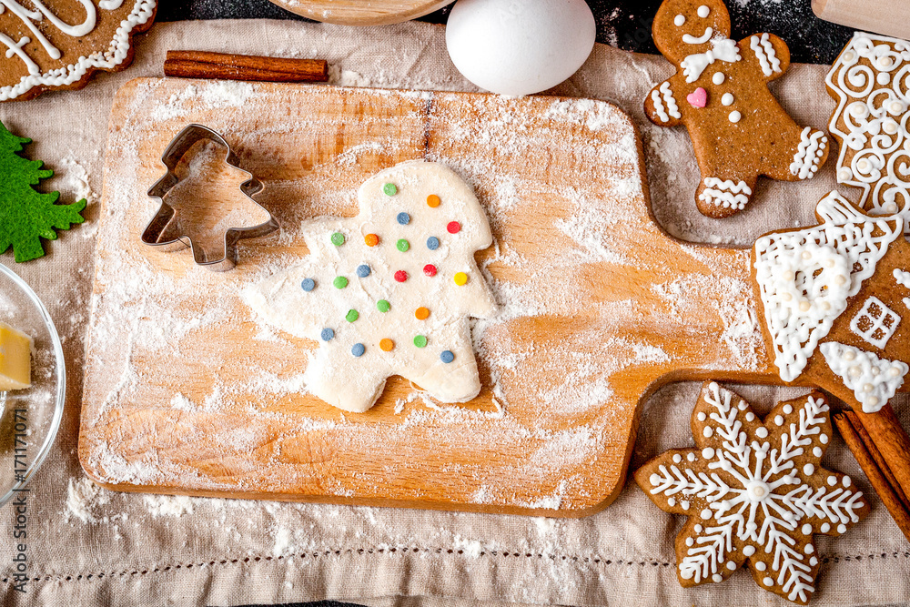 cooking christmas gingerbread on wooden background top view