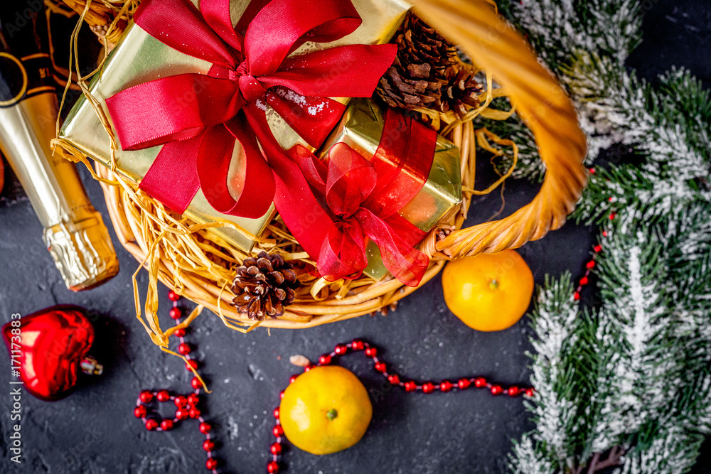 Christmas gifts and champagne with tangerines top view