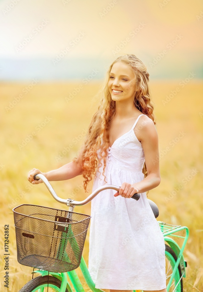 Young woman portrait with bike.