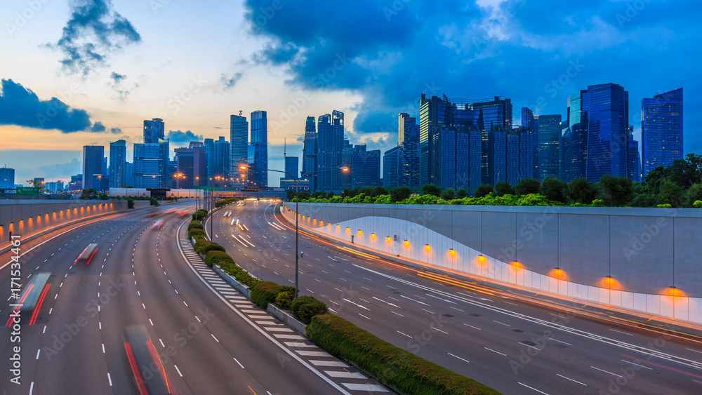 Road to Singapore City, Movement of car light with Singapore cityscape skyline during sunset.