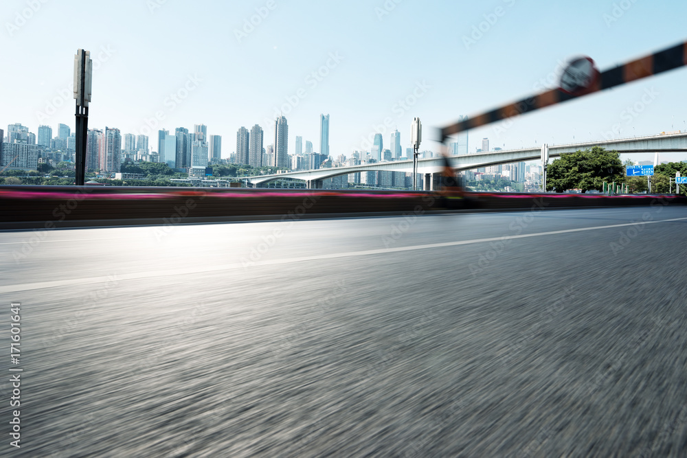 empty asphalt road with cityscape of modern city